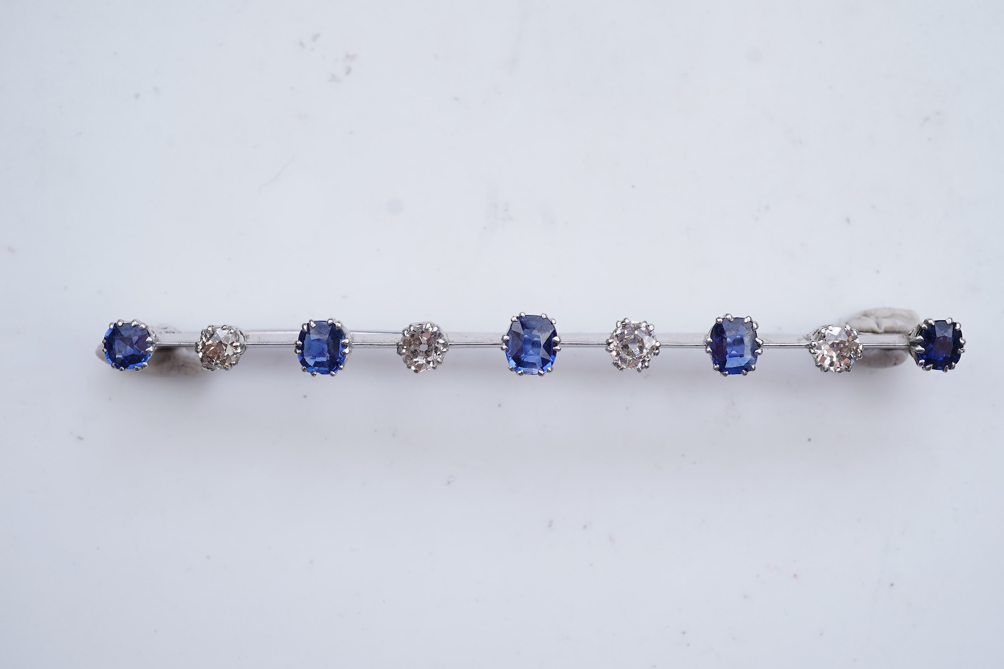 A diamond and sapphire bar brooch, early 20th century